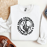 a white sweatshirt with a black design on it