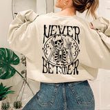 a woman wearing a sweatshirt with a skeleton on it