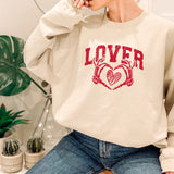 a woman wearing a sweatshirt with the word lover on it