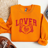 a pair of shoes and a sweater on a white surface