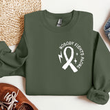 a green sweatshirt with a white ribbon and a pair of shoes