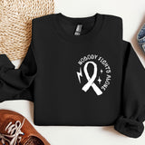 a black shirt with a white ribbon and a pair of shoes