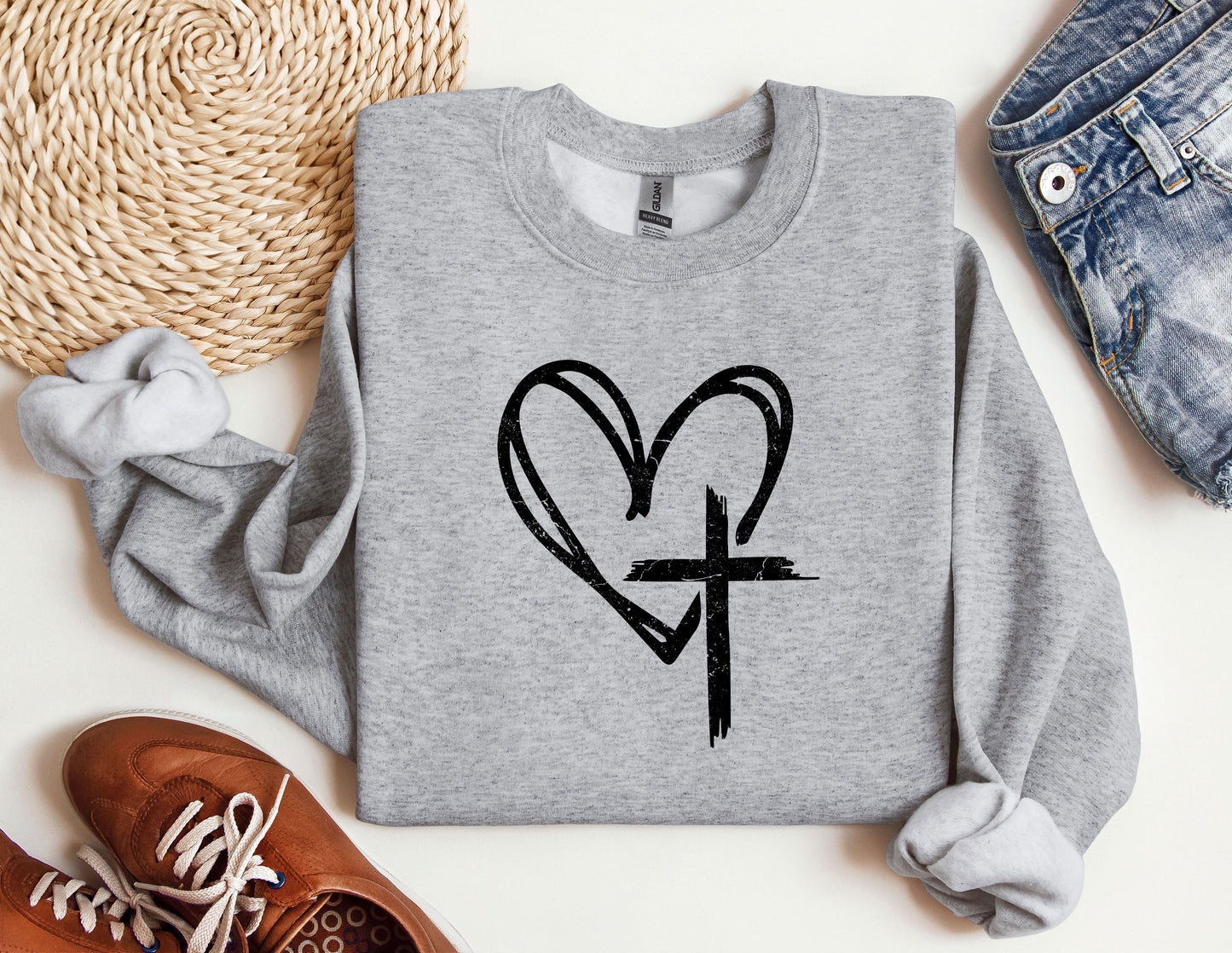 a sweatshirt with a heart and cross drawn on it