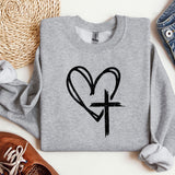 a sweatshirt with a heart and cross drawn on it