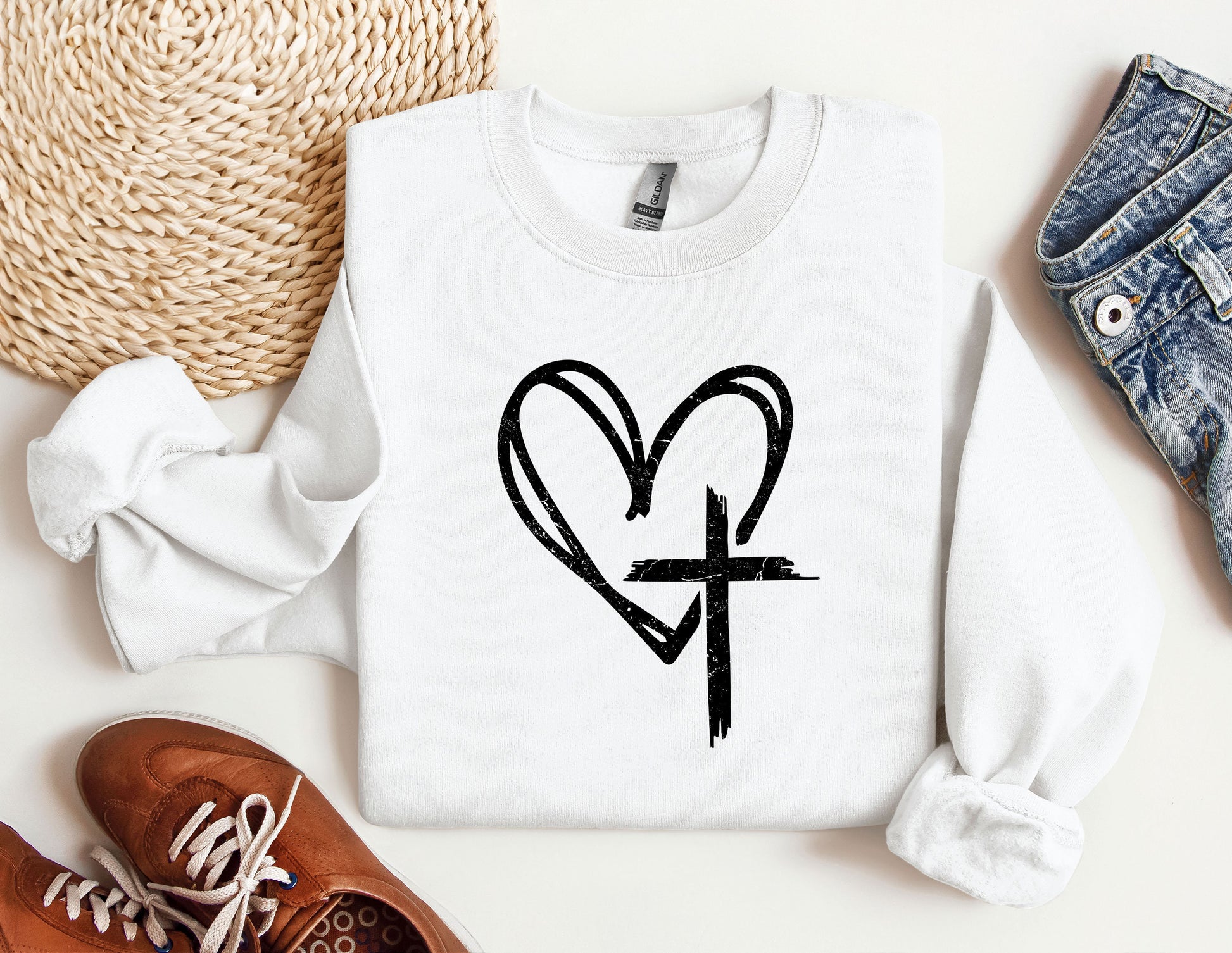 a white shirt with a heart and cross drawn on it