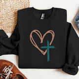 a black sweatshirt with a heart and a cross on it