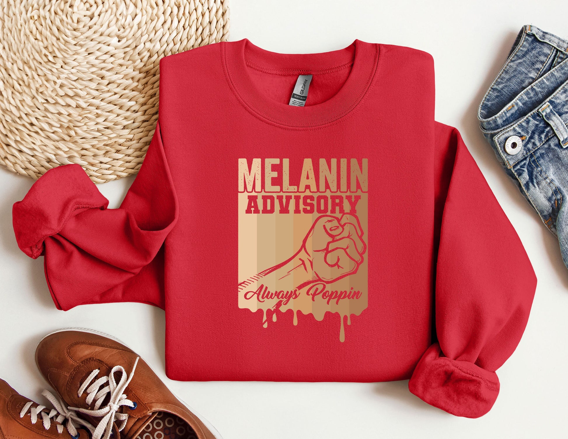 a red sweatshirt that says melanin advisory on it