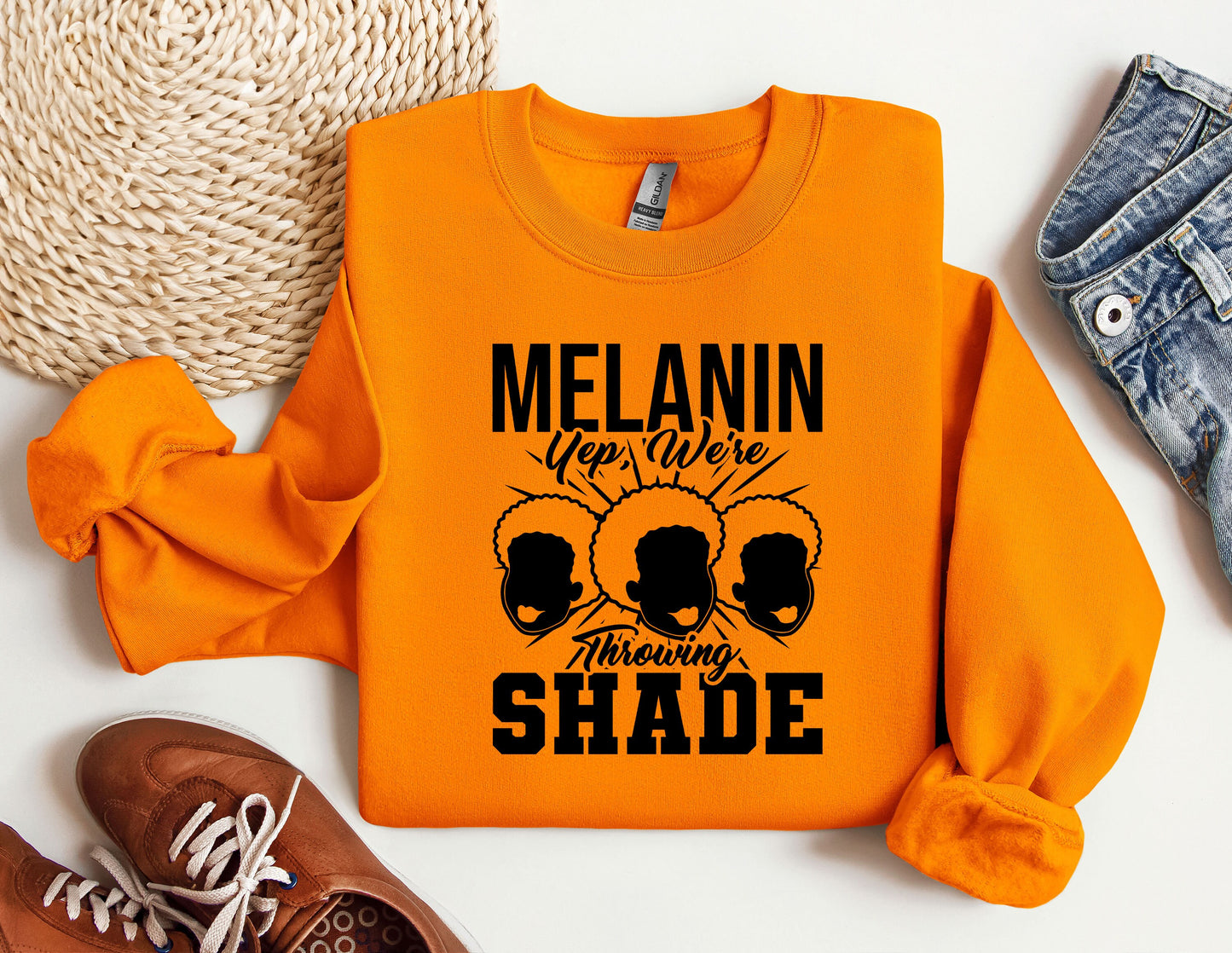 an orange sweatshirt with the words melanin on it