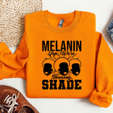 an orange sweatshirt with the words melanin on it