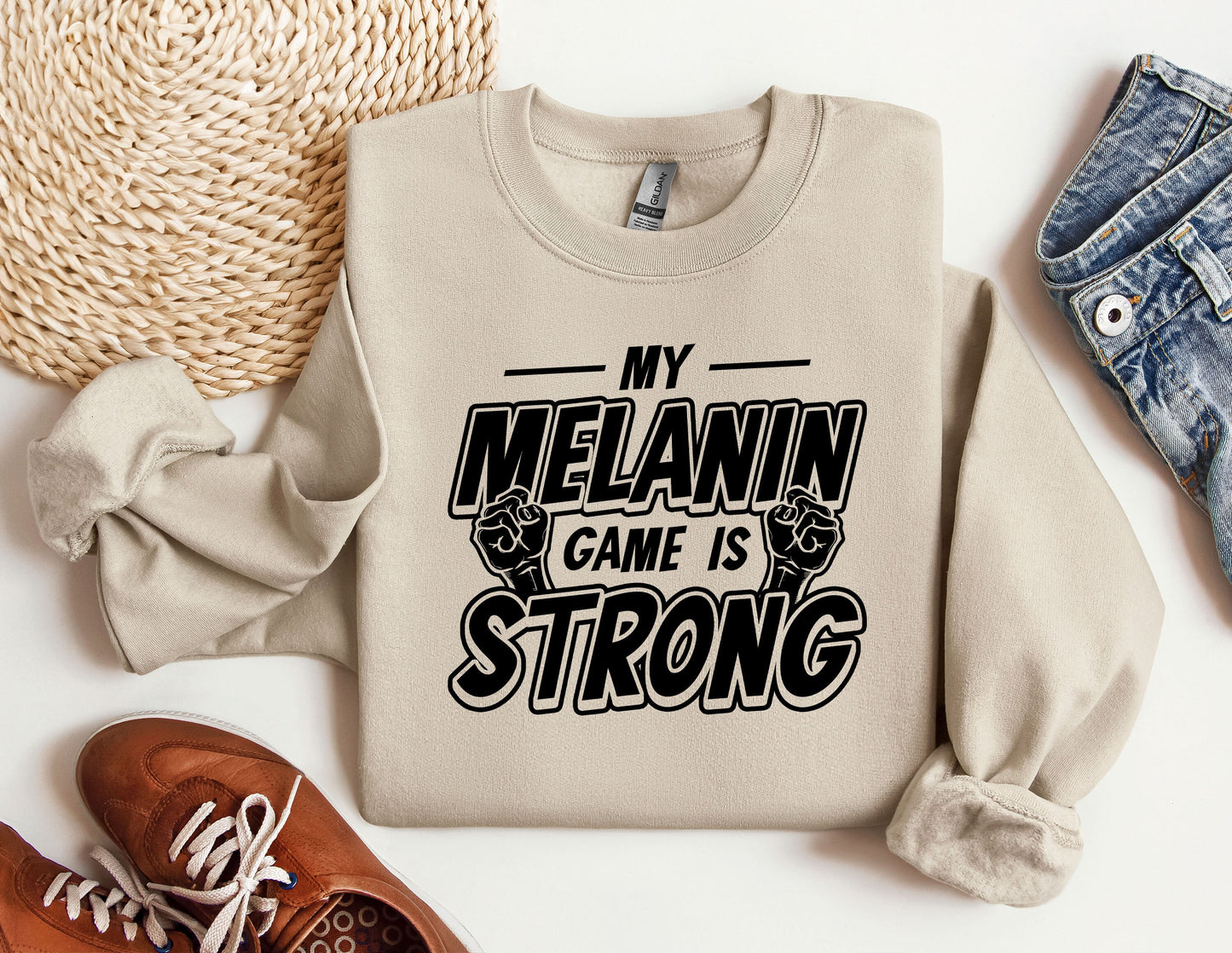 a sweatshirt that says, my melanin game is strong