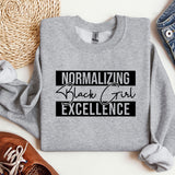 a sweatshirt with the words normalizing black girl excellence on it