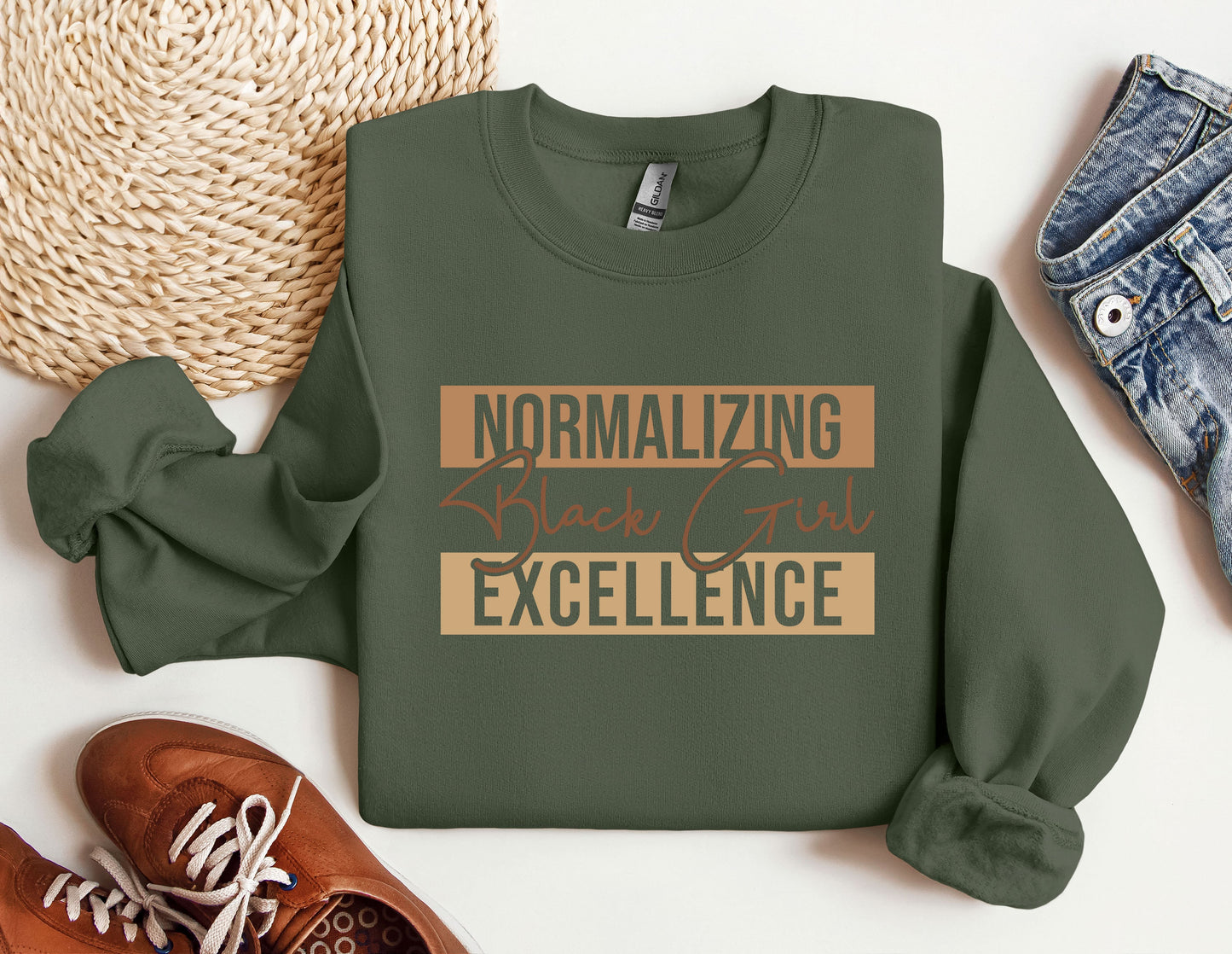 a green sweatshirt with the words normalizing black girl excellence on it