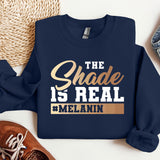 a sweatshirt that says the shade is real and melanin