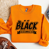 an orange sweatshirt with we are black excellence on it