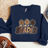 a sweatshirt with the words we come in all shades printed on it