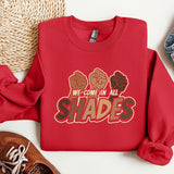 a red sweatshirt that says we come in all shades