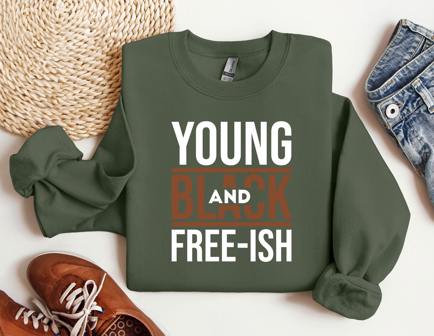 a green sweatshirt with the words young and black free - ish on it