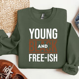 a green sweatshirt with the words young and black free - ish on it