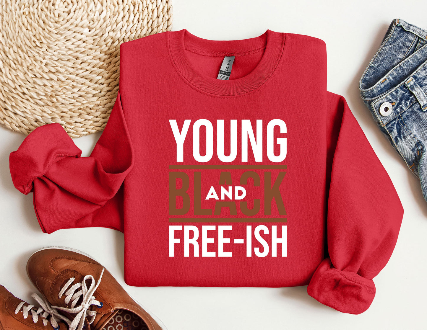 a red shirt that says young and black free - ish