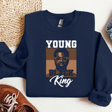 a blue sweatshirt with a picture of a black king on it