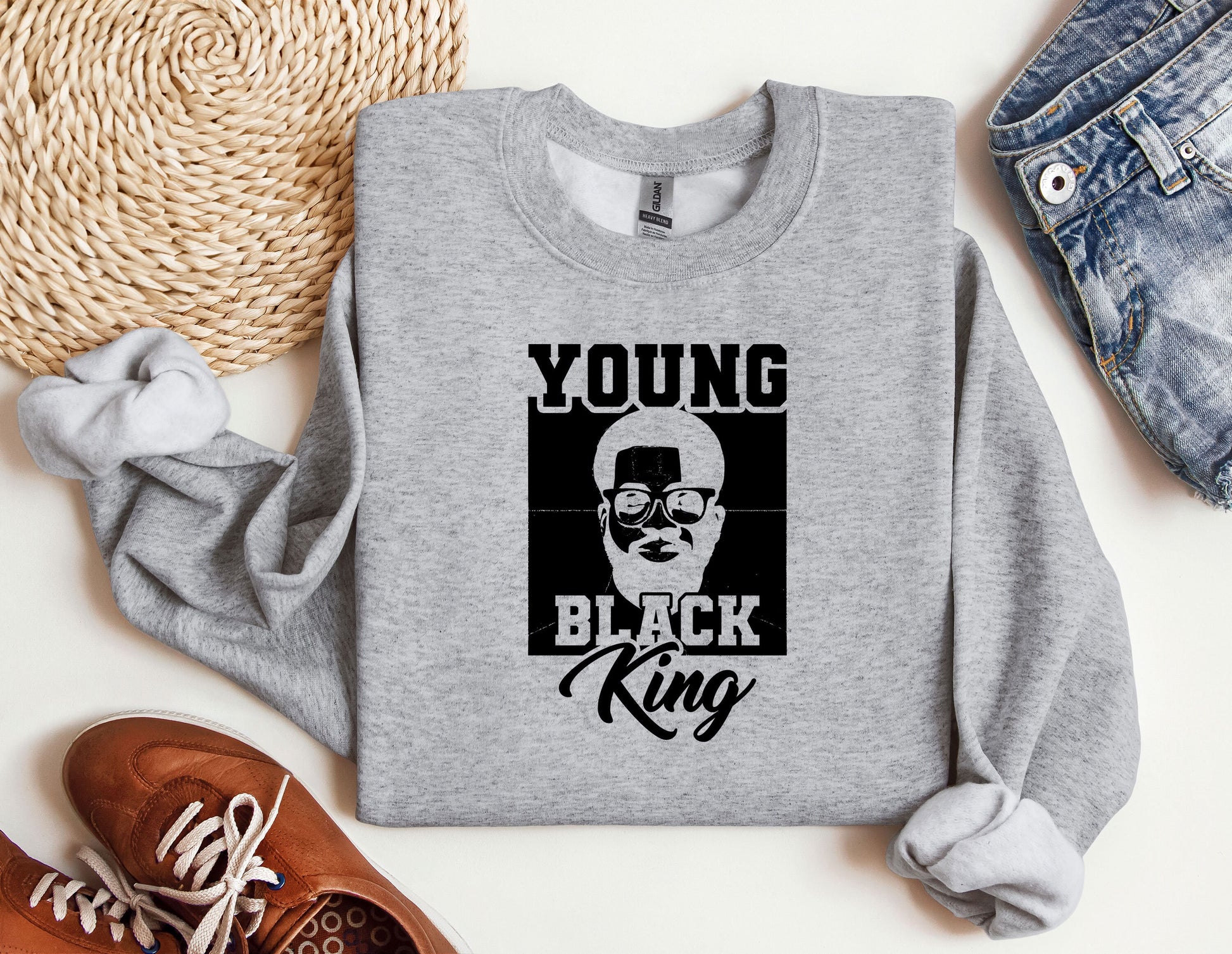 a young black king sweatshirt sitting on top of a table