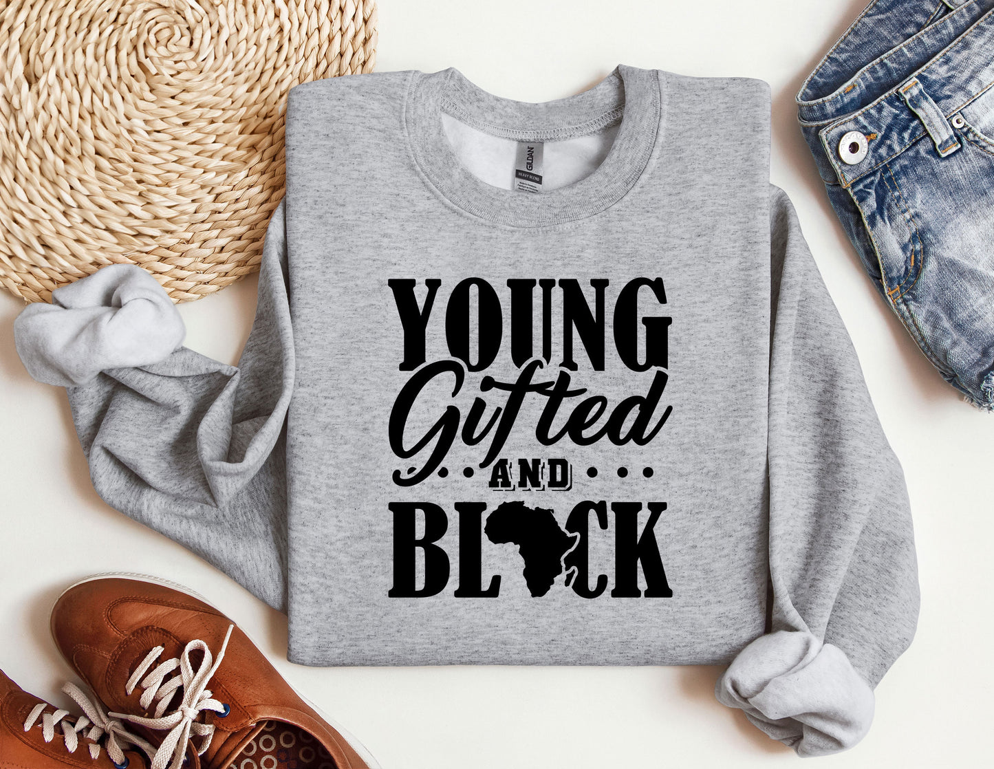 a sweatshirt with the words young, gifted, and black printed on it