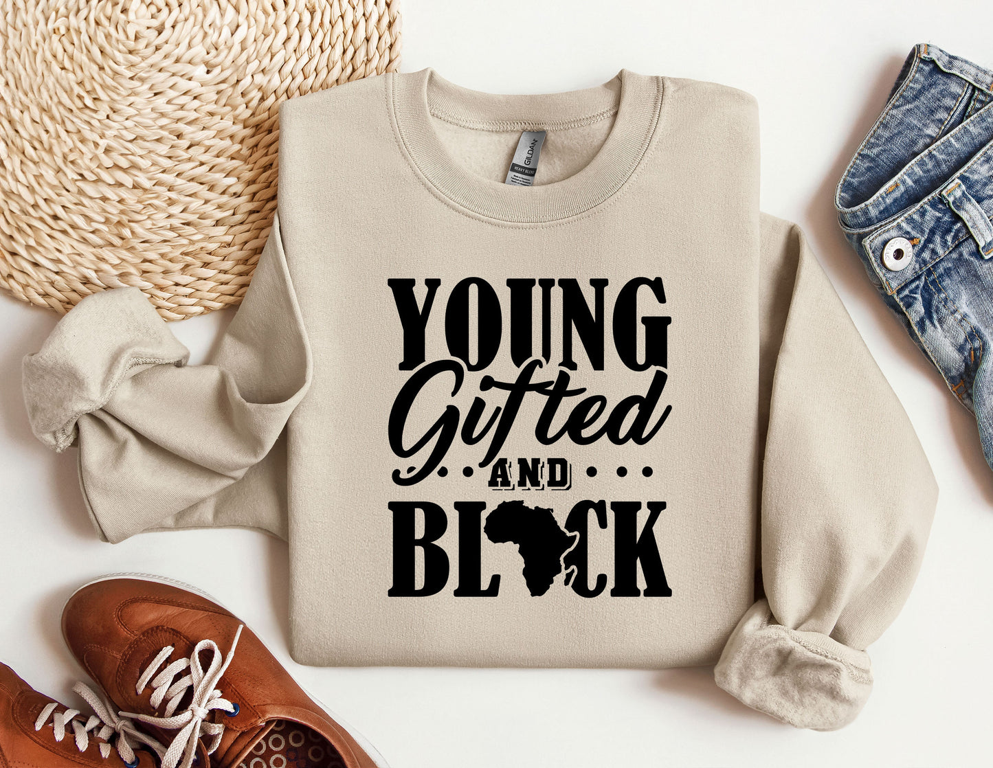 a sweater with the words young, gifted, and black printed on it