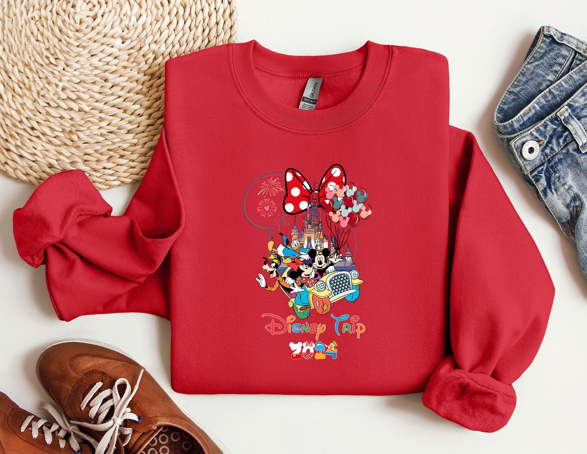 a red sweatshirt with mickey mouse on it