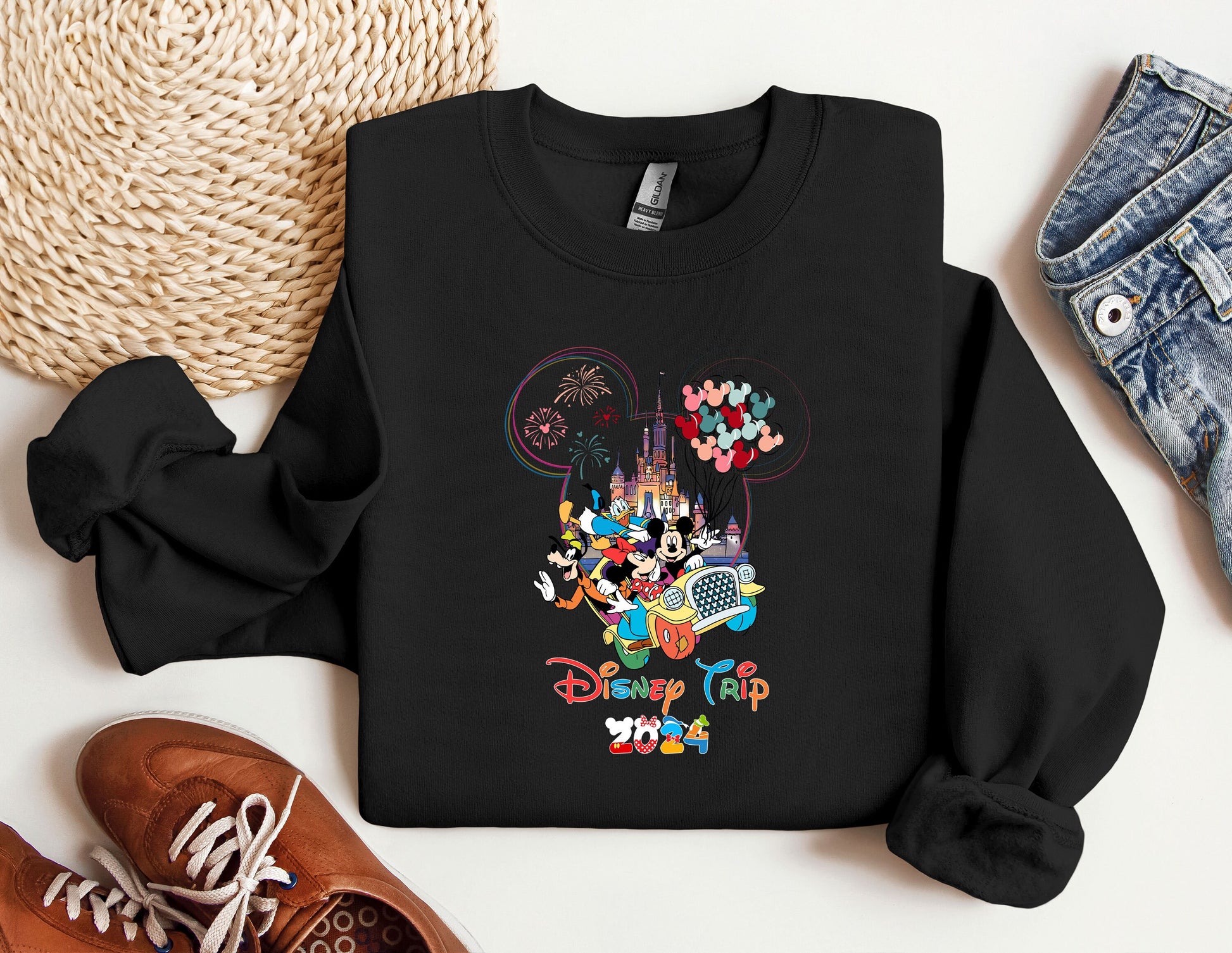 a black sweatshirt with a mickey mouse design on it