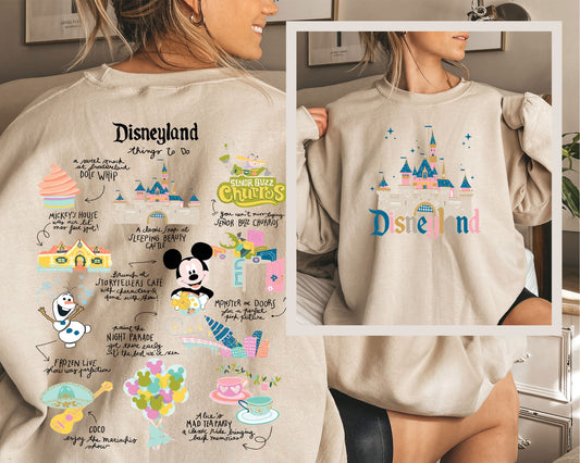 a woman wearing a sweatshirt with a mickey mouse design on it