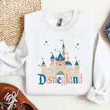 a white shirt with a disneyland castle on it