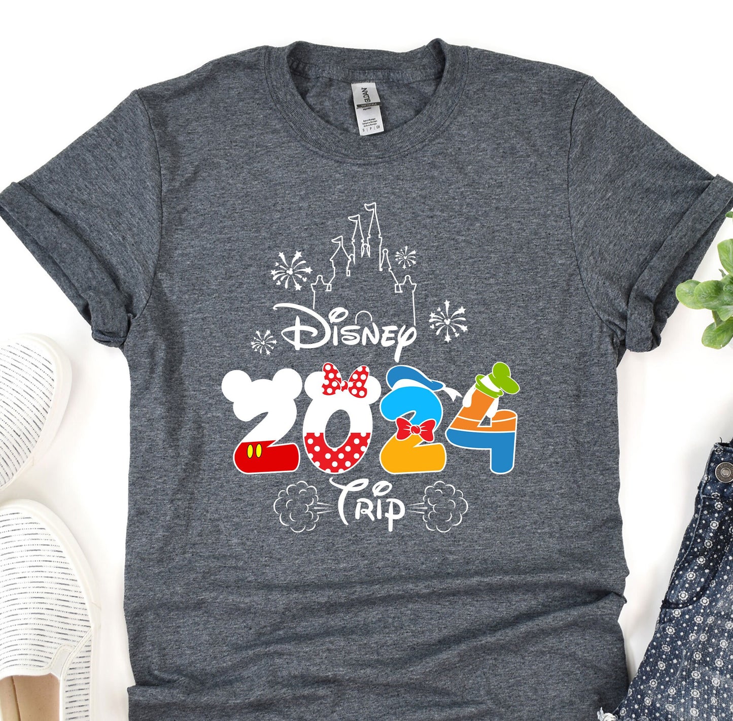 a gray shirt with mickey mouse and mickey mouse ears on it