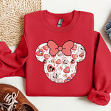 a red shirt with a minnie mouse design on it