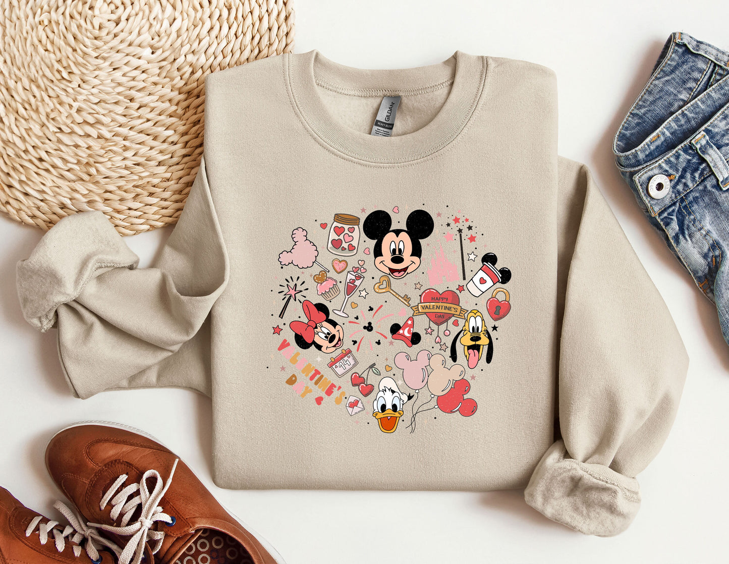 a sweater with a mickey mouse design on it