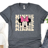 a minnie mouse shirt with a pink bow on it