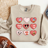 a sweater with hearts and mickey mouse faces on it