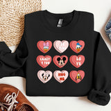 a black shirt with hearts and mickey mouses on it