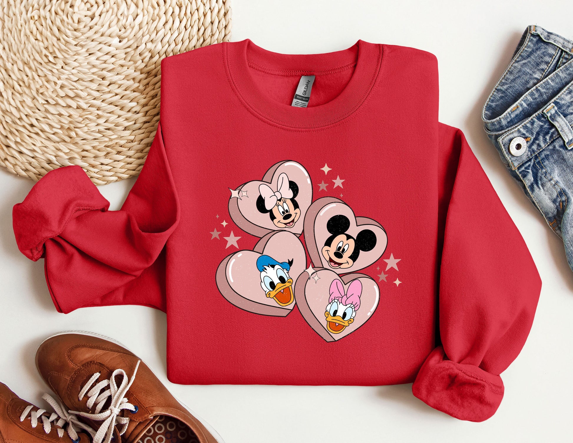 a red sweatshirt with mickey mouse hearts on it