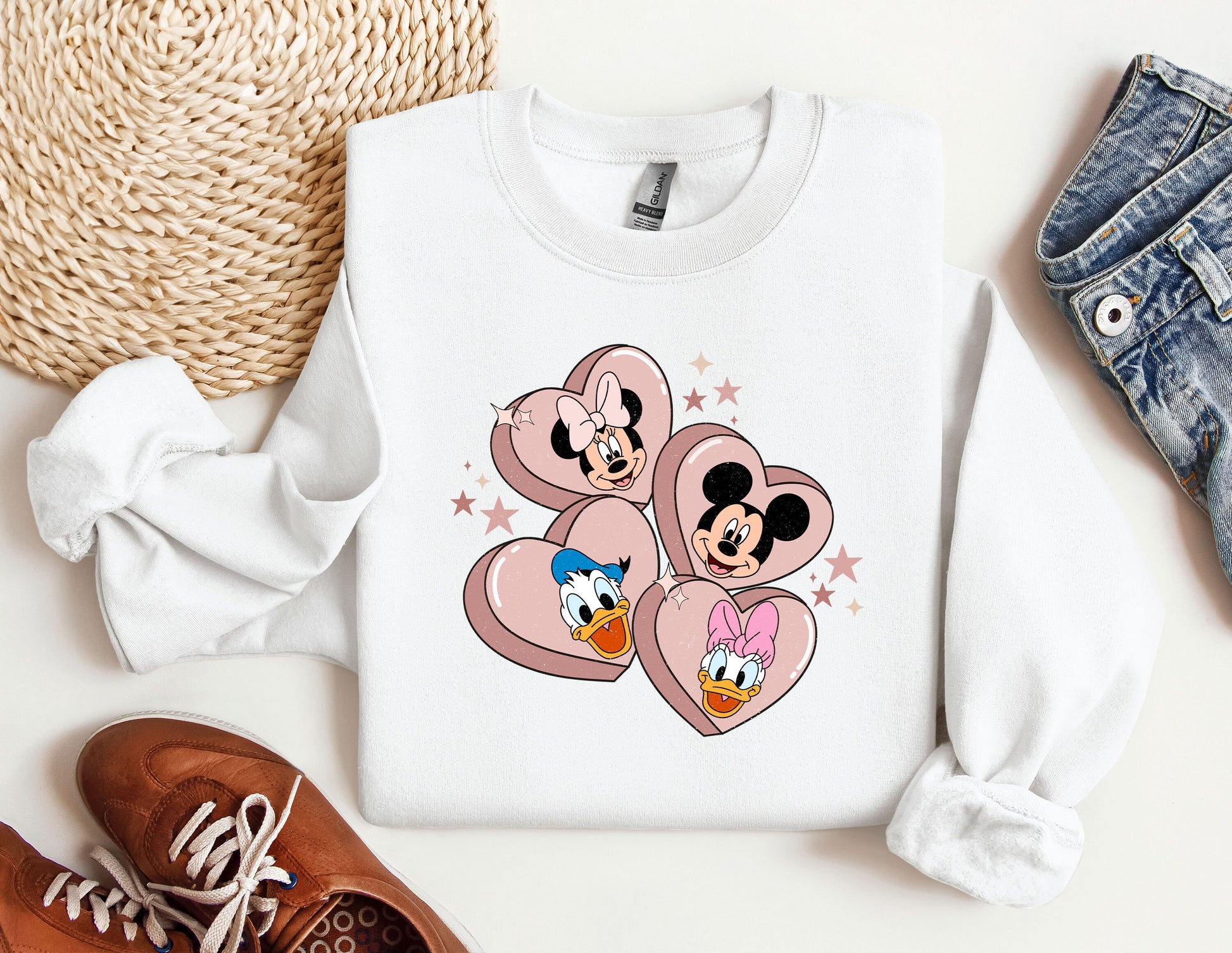 a pair of sneakers and a mickey mouse sweatshirt