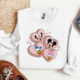a pair of sneakers and a mickey mouse sweatshirt