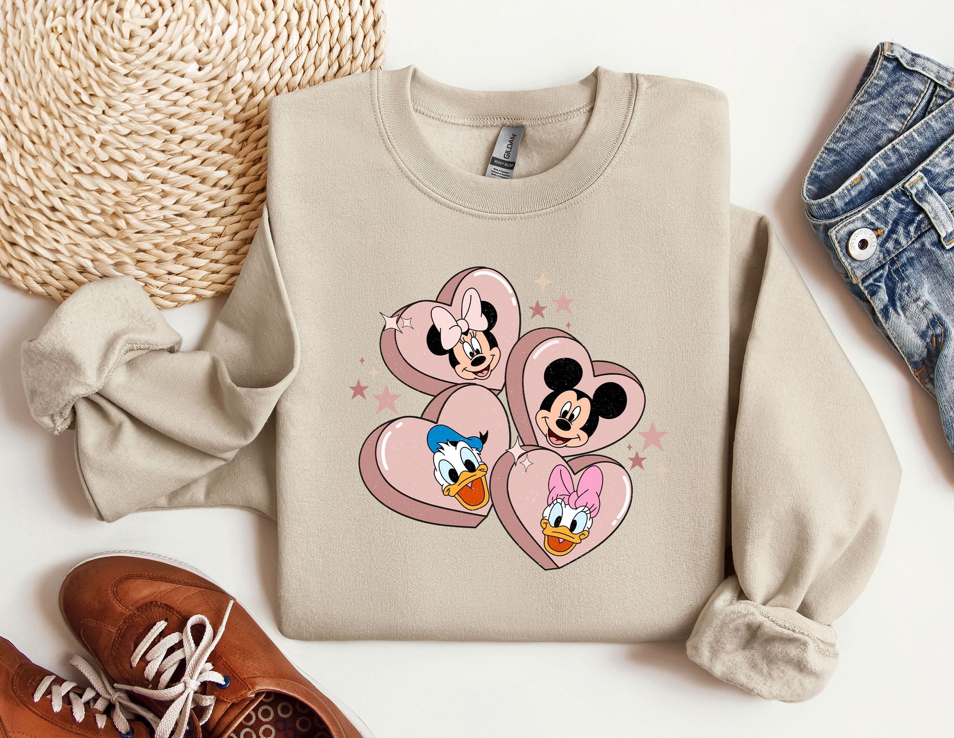 a pair of shoes and a sweater with mickey mouse on it