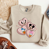 a pair of shoes and a sweater with mickey mouse on it