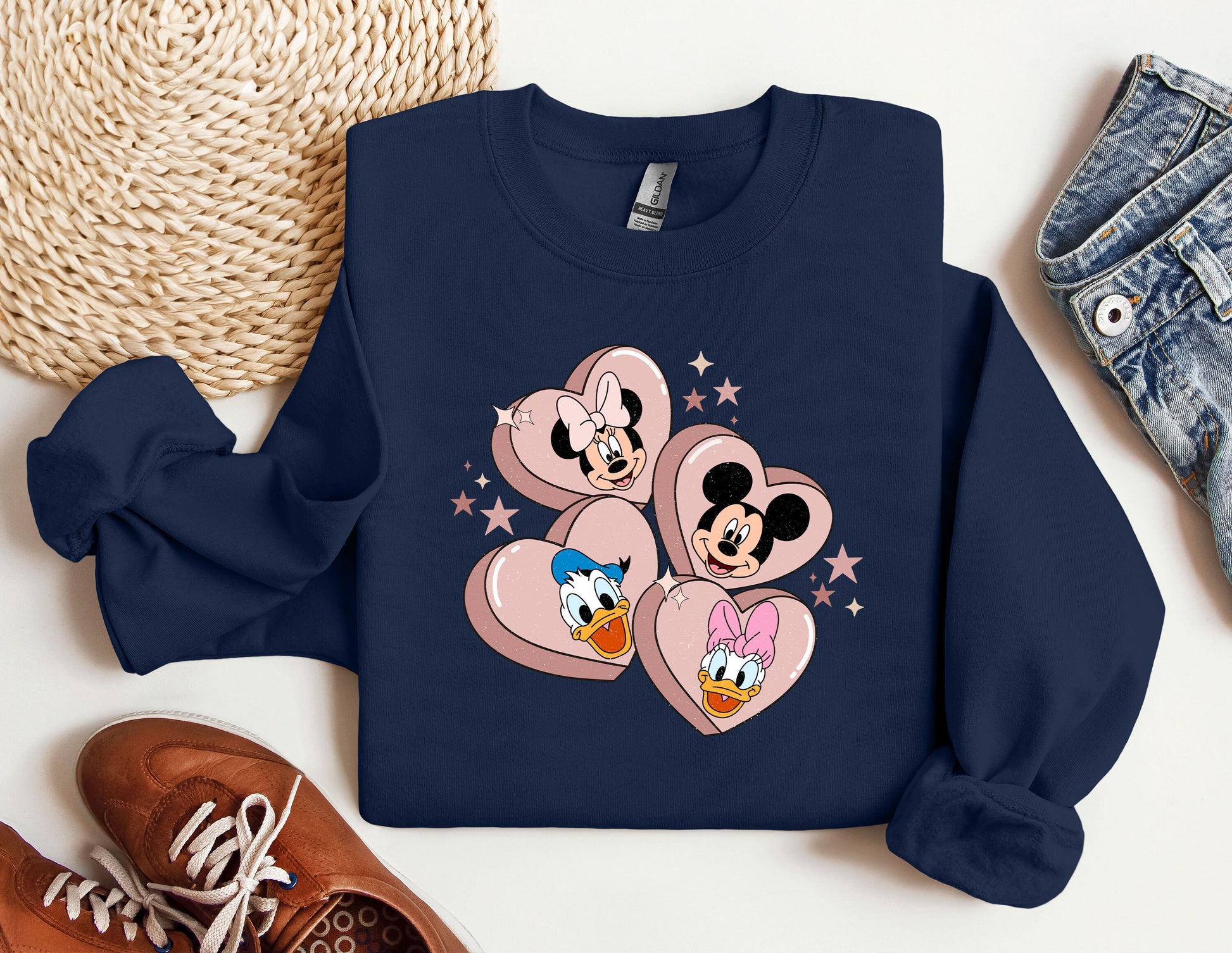 a blue sweatshirt with mickey and minnie mouses on it