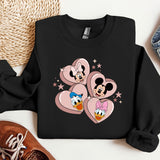 a black sweatshirt with mickey and minnie mouses on it
