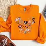 a pair of shoes and a mickey mouse sweatshirt