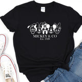 a mickey and mickey mouse t - shirt next to a pair of jeans
