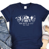 a mickey and mickey mouse t - shirt next to a pair of jeans
