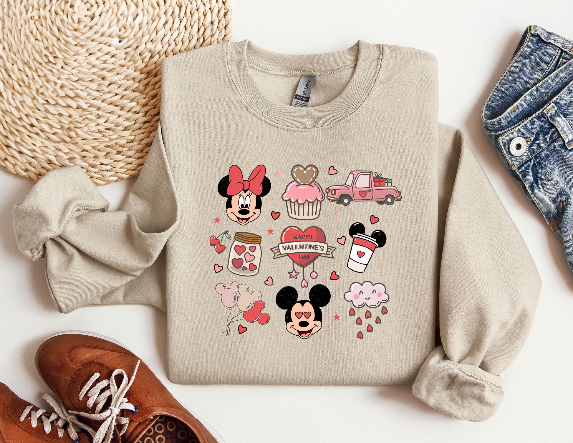 a sweater with mickey and minnie mouses on it