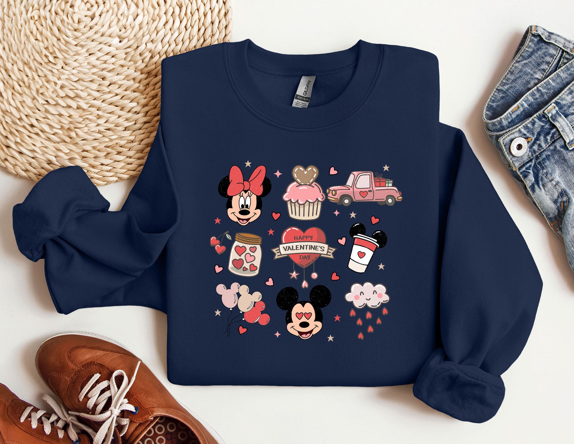 a blue sweatshirt with mickey and minnie mouses on it