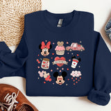 a blue sweatshirt with mickey and minnie mouses on it